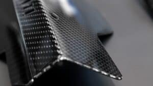 A,Close-up,On,A,Car,Exterior,Elements,Made,From,Carbon Composite material that has been finished