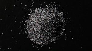 Small mound of steel grit blasting media