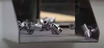 parts being processed through vibratory finishing